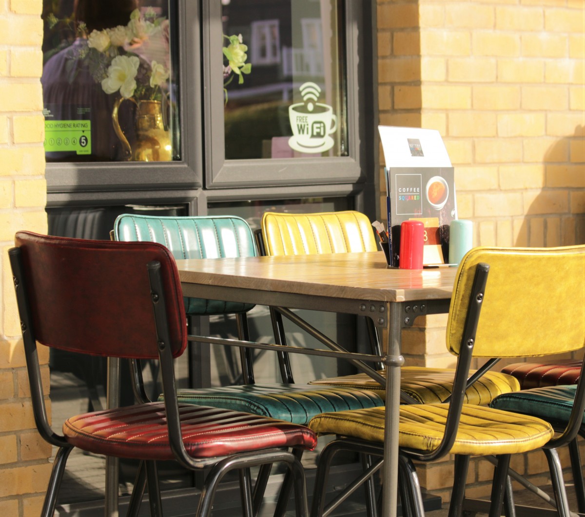 Colourful chairs on the terrace