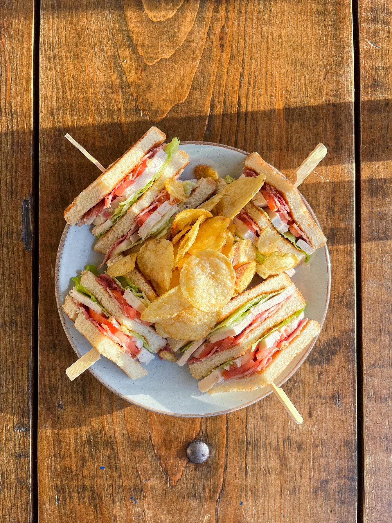 Triple decker club sandwich with crisps