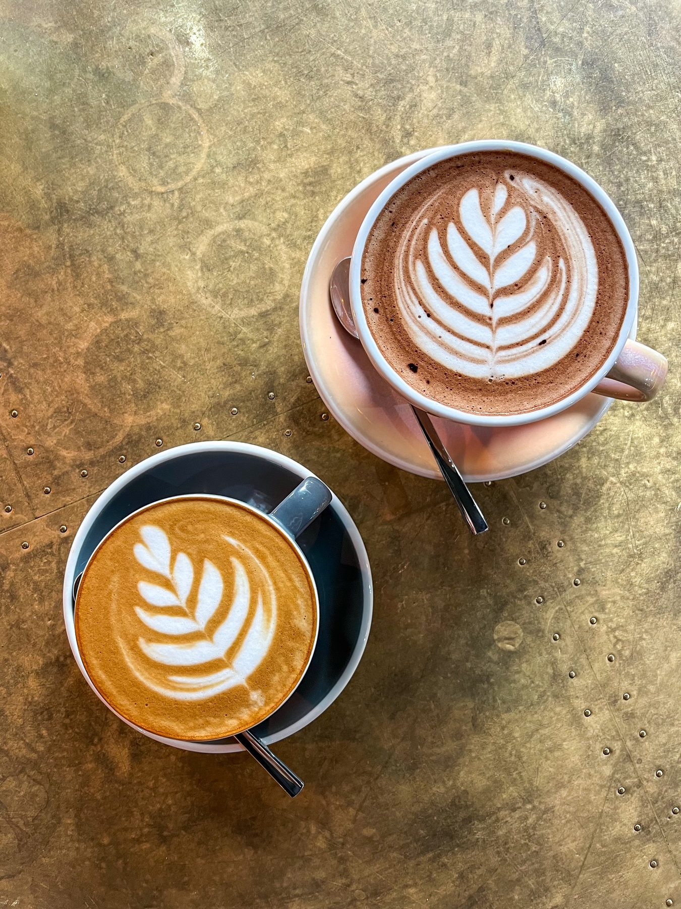 Two coffees with latte art
